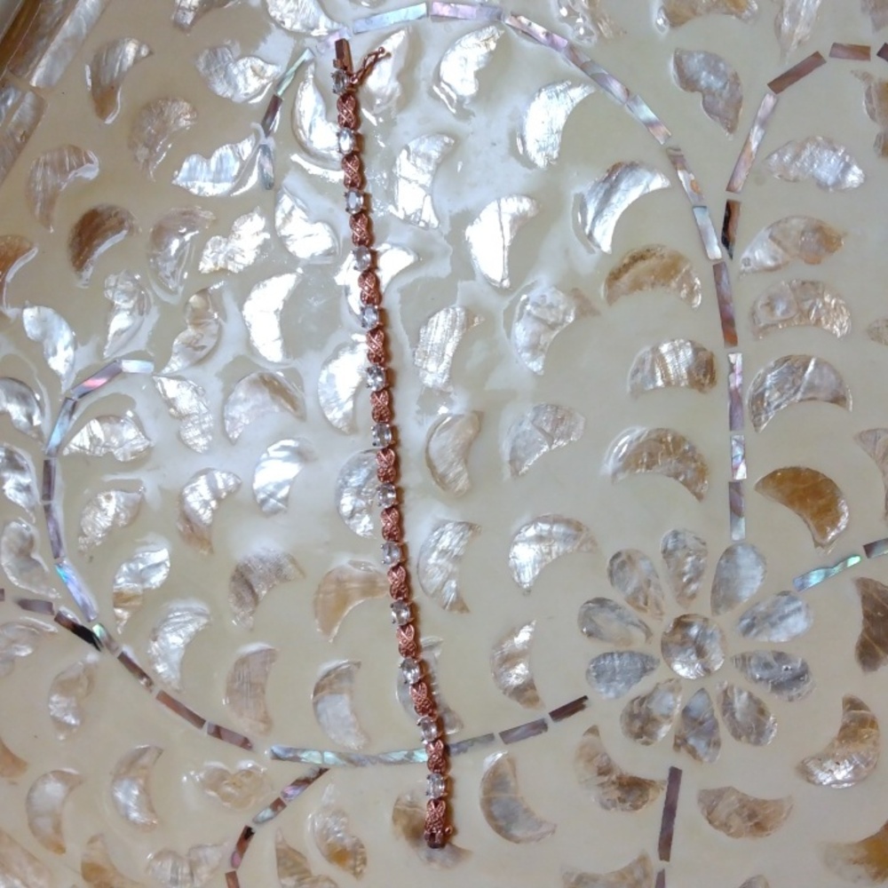 Bracelet,Rose gold with white topaz,X's & O's design.